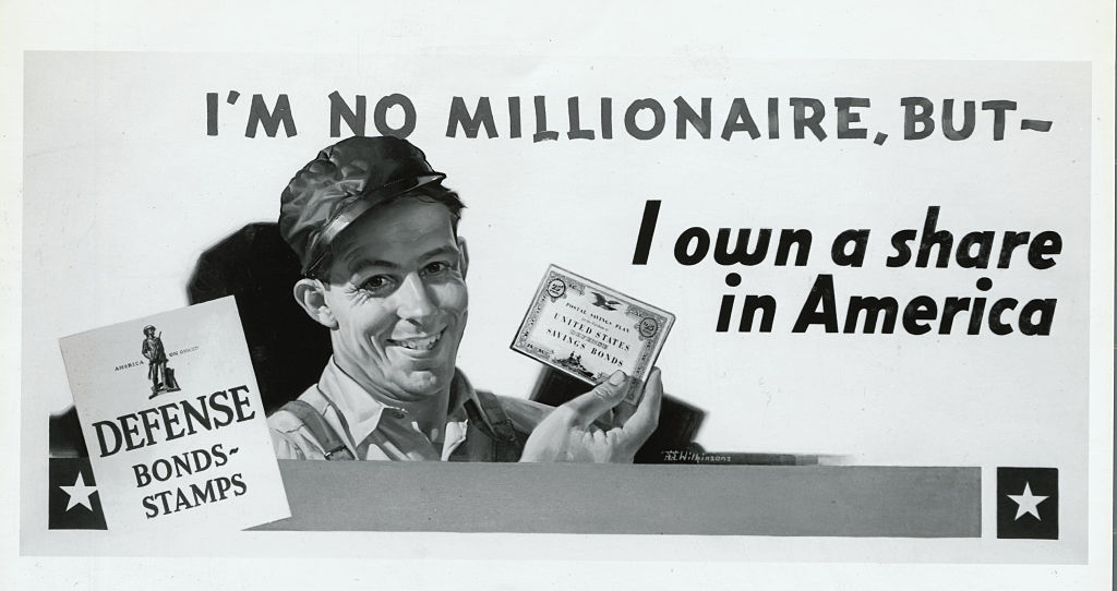 1941 war bond poster, showing a man holding a U.S. savings bond (Getty Images/Bettmann)