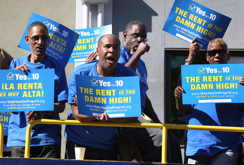 Supporters of Proposition 10, in favor of rent control and building more affordable housing, listen to labor and civic leaders speak during a press conference on Wednesday, Oct. 24, 2018 in Sacramento, Calif. (Steve Yeater/AP Images for AIDS Healthcare Foundation)