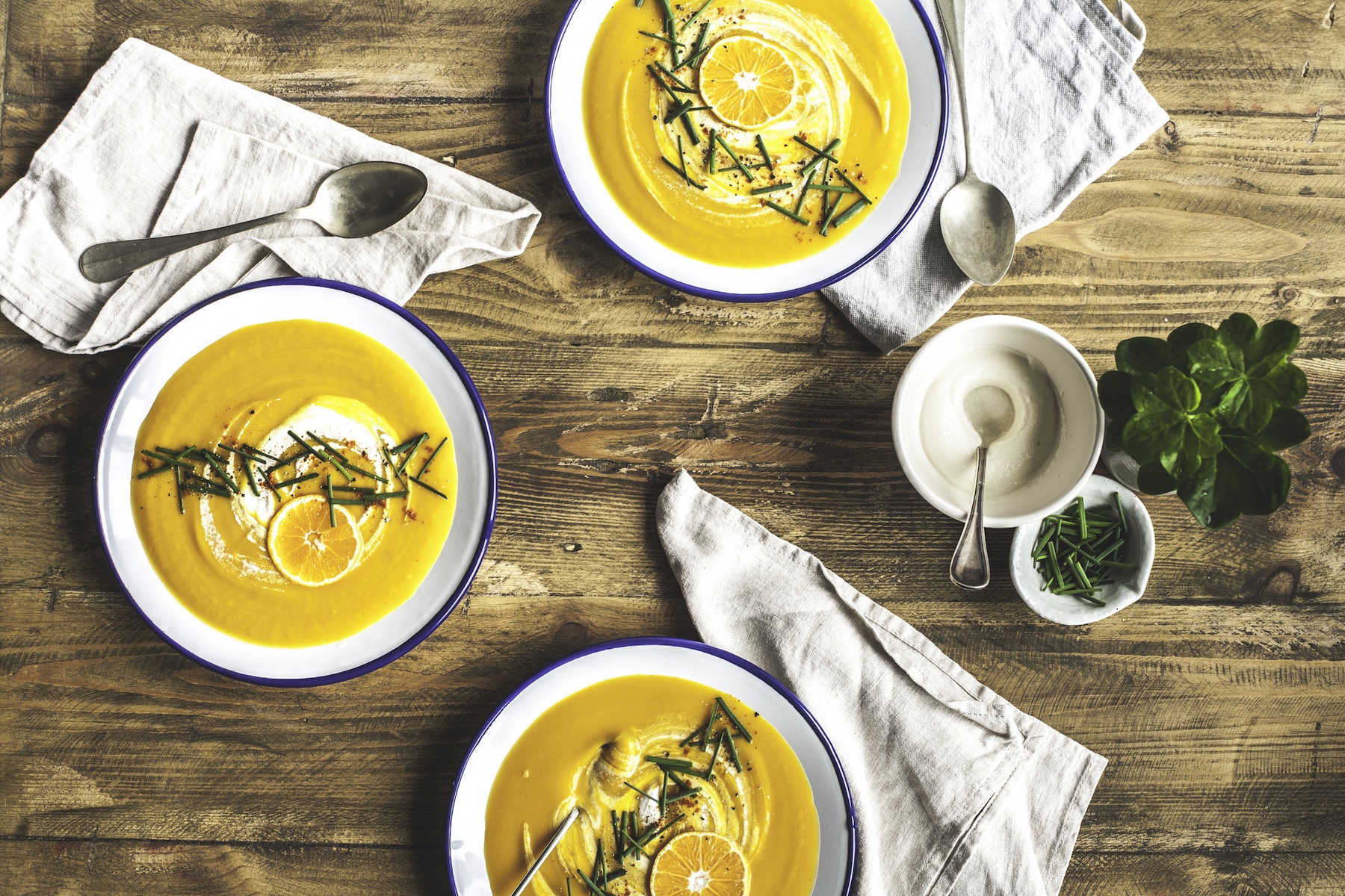 Three bowls of carrot and orange soup (Enrique Díaz / 7cero / Getty Images)