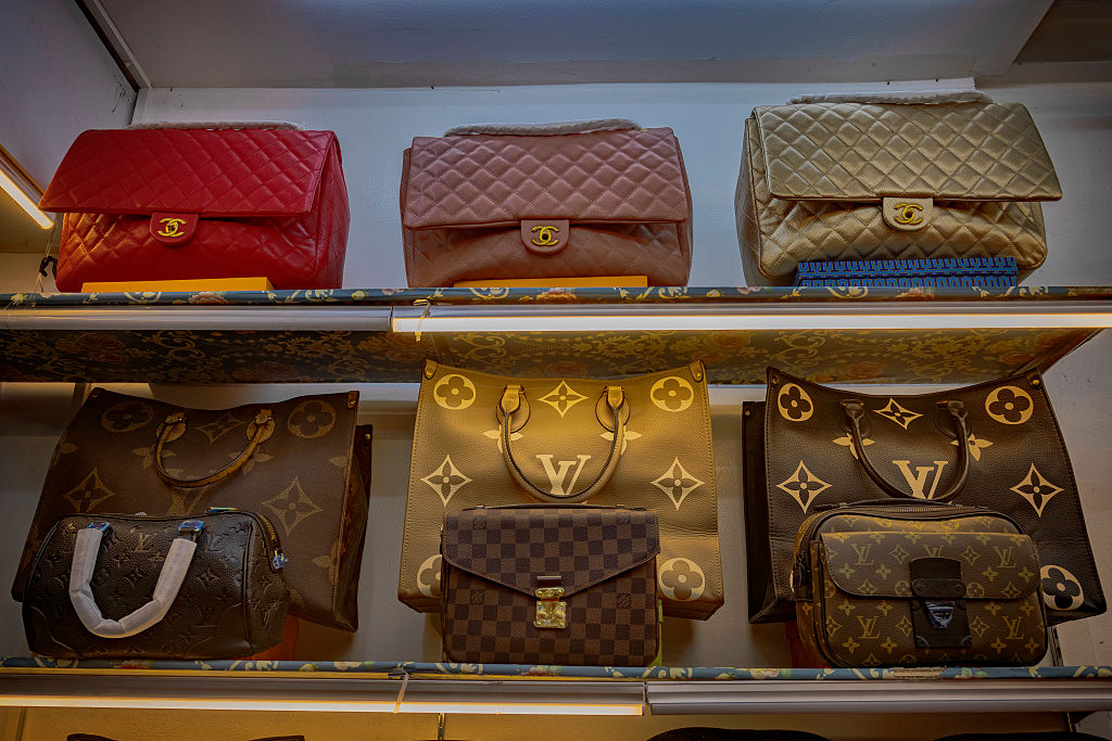 Imitations of Chanel and Louis Vuitton bags imported from China are seen for sale at a mall on April 23, 2025 in Manila, Philippines. (Getty Images/Ezra Acayan)