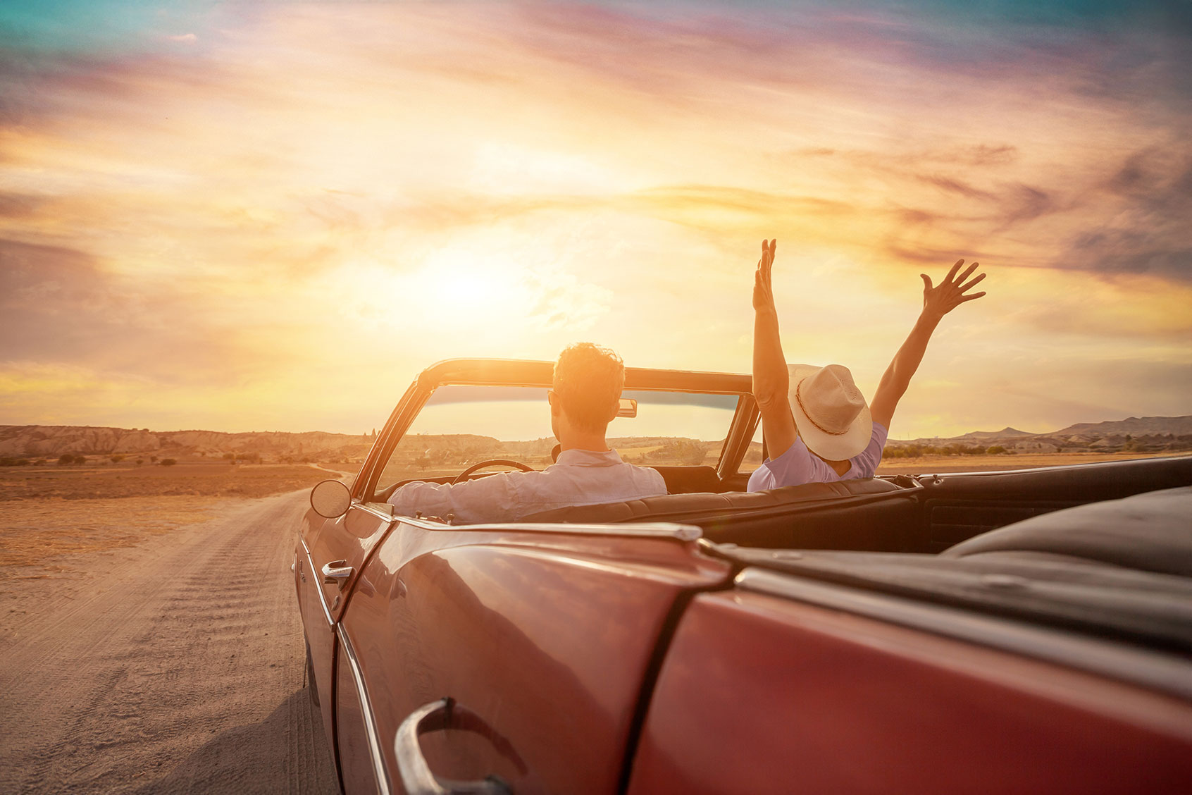 Couple traveling on the open road (Getty Images/anyaberkut)