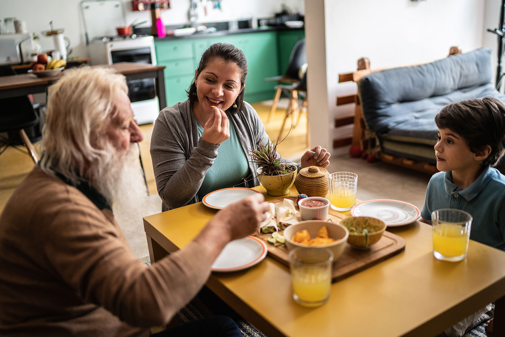 Family eating food together (Getty Images/FG Trade)