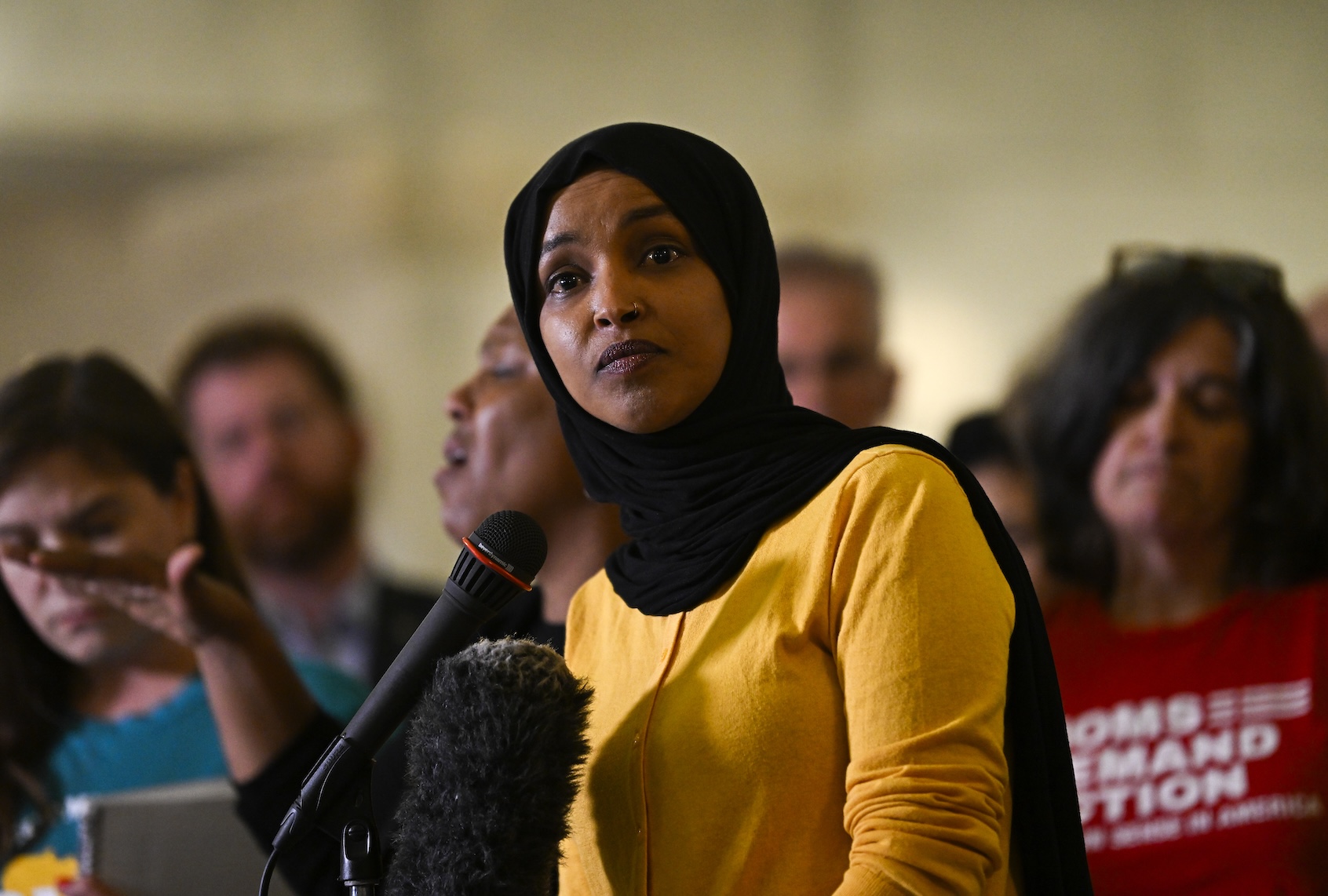 MINNEAPOLIS, MINNESOTA - AUGUST 28: U.S. Rep. Ilhan Omar (D-MN) (C) speaks during a press conference at City Hall following a mass shooting at Annunciation Catholic School on August 28, 2025 in Minneapolis, Minnesota. According to Minneapolis Police, a gunman fired through the windows of the Annunciation Church at worshippers sitting in pews during a Catholic school Mass, killing two children and injuring at least 17 others. The gunman reportedly died at the scene from a self-inflicted gunshot wound. (Photo by Stephen Maturen/Getty Images)
