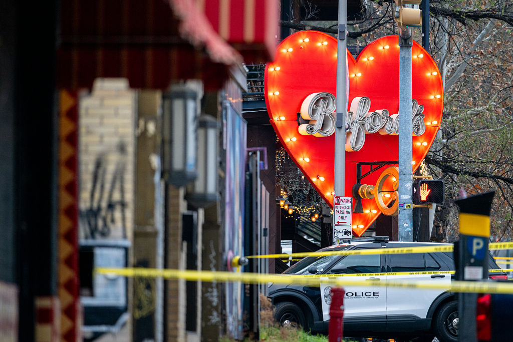 A law enforcement unit sits at the entrance to Buford's bar in downtown Austin. Three people are dead and 14 others hospitalized following a possible terrorist shooting. (Brandon Bell / Getty Images)