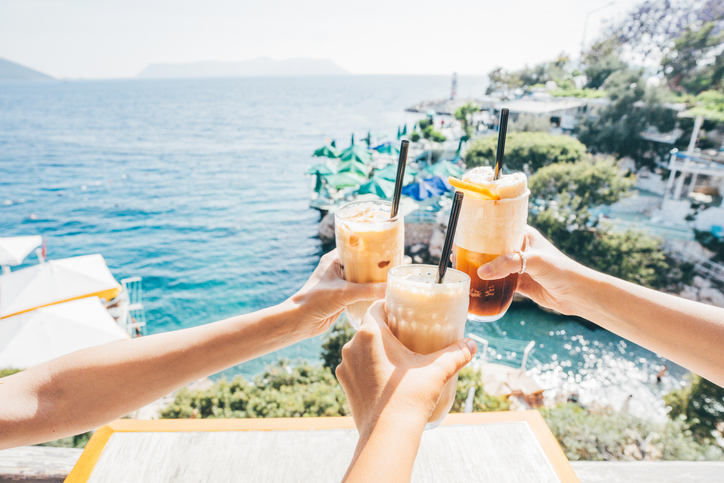 Sharing a drink on vacation might not be as easy as you think. (Maria Korneeva/Getty Images)