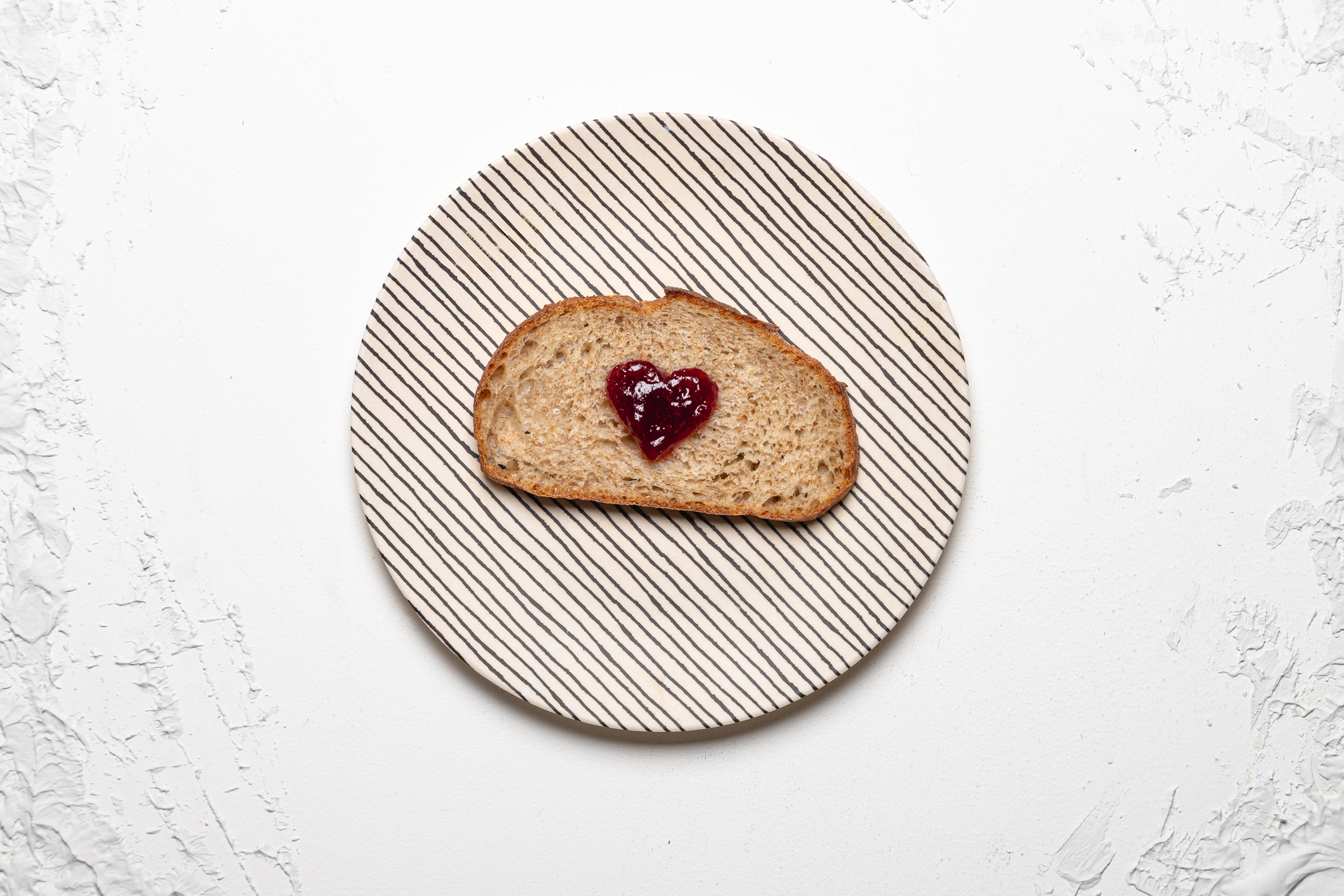 Bread with heart-shaped jam dot (Maria Camila Tobon / Getty Images)