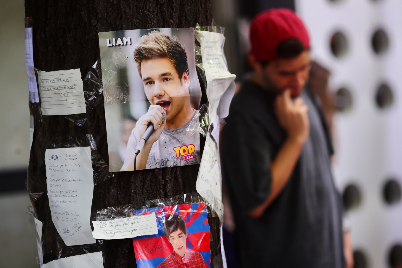 A portrait of Liam Payne is seen placed on a tree outside Casa Sur Hotel on October 17, 2024 in Buenos Aires, Argentina. (Marcos Brindicci/Getty Images)