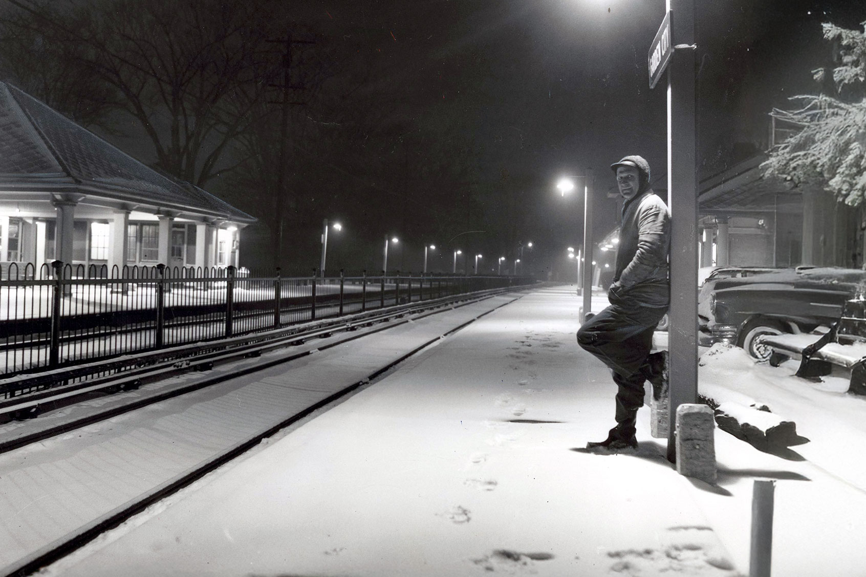 A man waits for a train on a snow covered platform at the Garden City LIRR station on January 15, 1961. (Jim Cavanagh/Newsday RM via Getty Images)