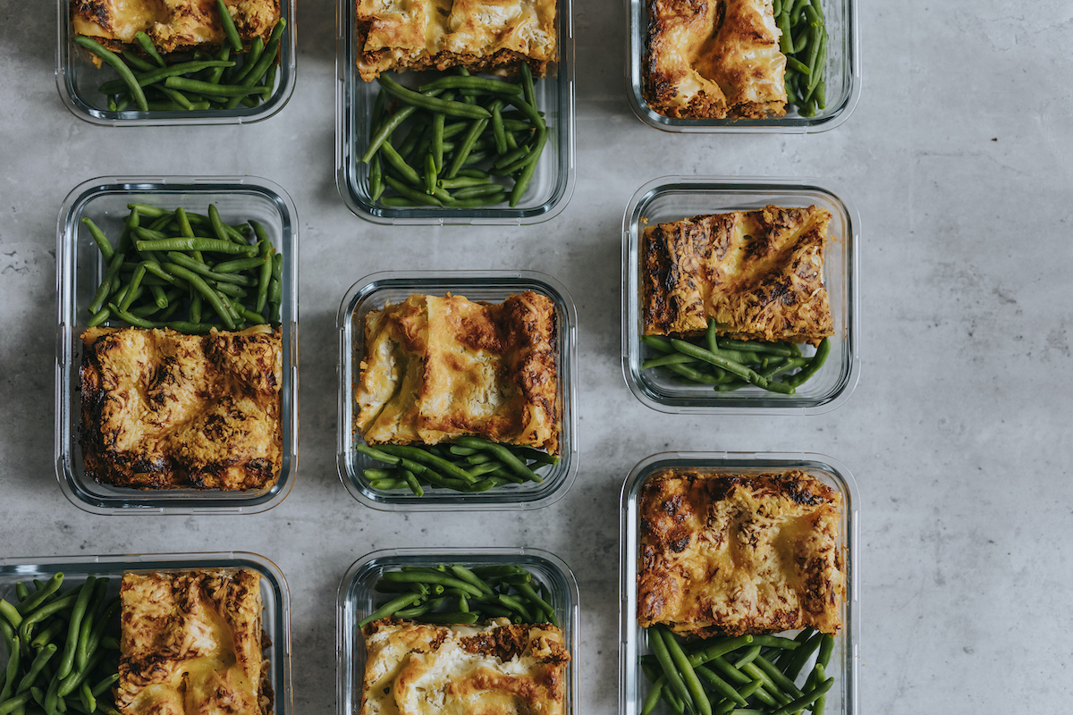 Overhead view of meal-prepped lasagna and green beans (Johner Images/Getty Images)