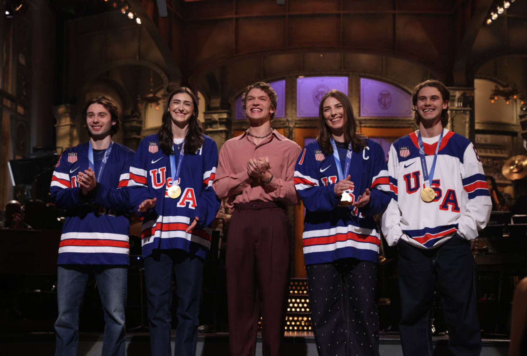 Quinn Hughes, Megan Keller, Connor Storrie, Hilary Knight and Jack Hughes on "Saturday Night Live" (Will Heath/NBC)