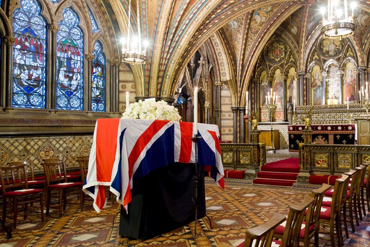 The coffin of British former Prime Minister Margaret Thatcher rests in the Crypt Chapel of St Mary Undercroft beneath the Houses of Parliament in central London on Tuesday April 16, 2013. (AP/Leon Neal)
