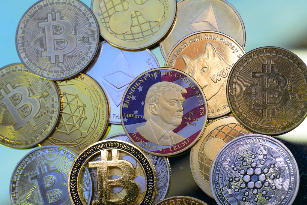 This photo illustration shows a representation of cryptocracy coins with the $Trump meme coin in Brussels, Belgium on March 3, 2025. (Getty Images/Jonathan Raa/NurPhoto)