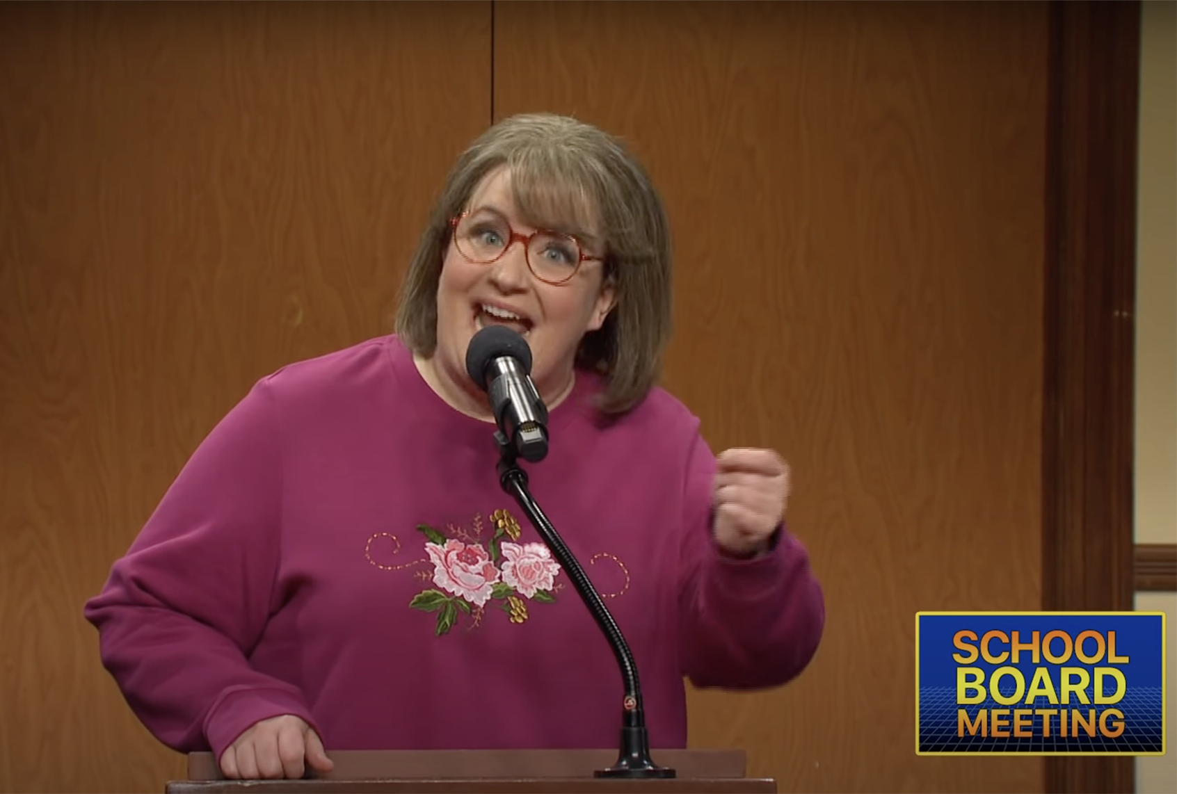 SNL cast member Aidy Bryant plays an unhinged parent at a school board meeting. (NBC)